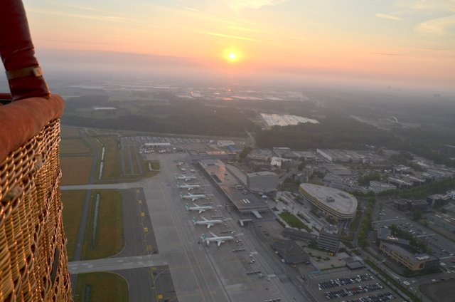 Sunrise above Eindhoven Airport during balloon flight